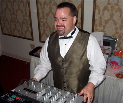 Emcee Rob Murray keeps watch over the dance floor to make sure everyone is having a good time.